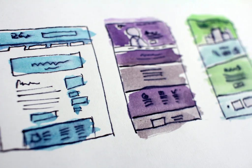 hand drawn and watercolored wireframes of a website or app