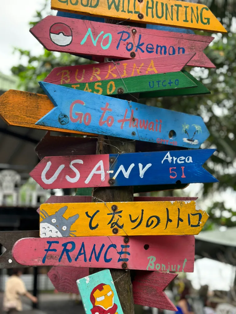 signs pointing in all directions burkina faso, hawaii, nevada, france